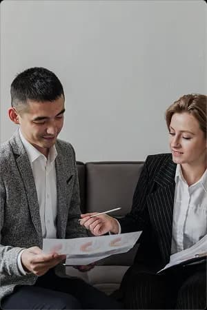 Payroll consultants reviewing salary configuration documents